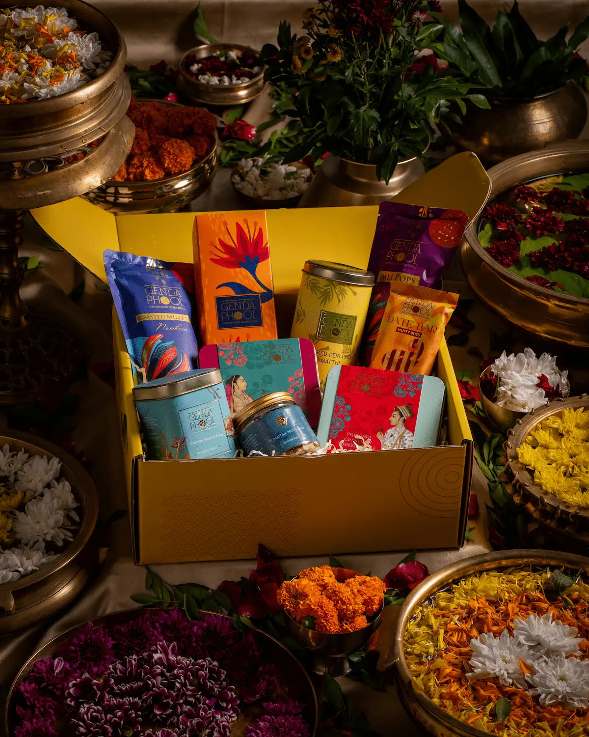 Assortment of hamper items from Genda Phool including mithai, snacks and dry fruits